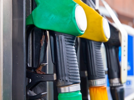 Fuel pump nozzles in a gas stationのeditorial素材