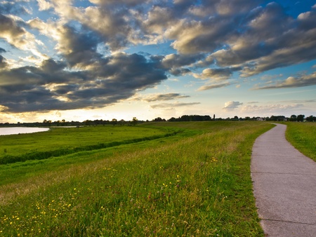 Cycling track on the river dike of the IJssel in the Netherlands