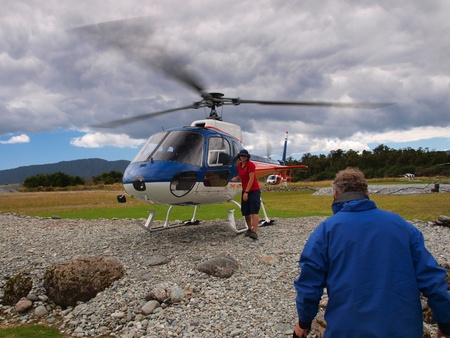 Tourist is going aboard an adventure helicopter to the new zealand wildernessのeditorial素材