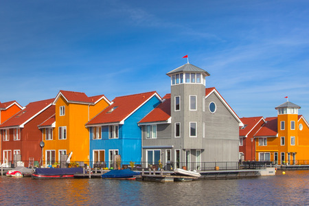 Waterfront houses in various colors in Groningen, Netherlandsのeditorial素材