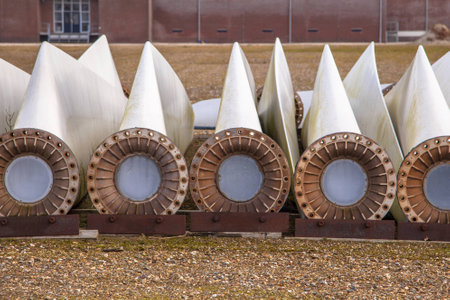 A row of spare wind turbine blades on wins turbine maintenance yard