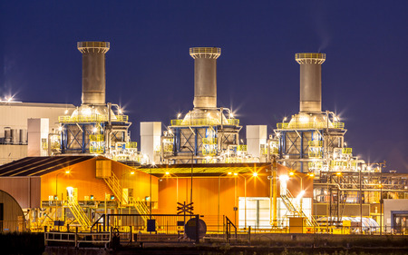 Heavy Chemical industry night shot with railroad on the foreground