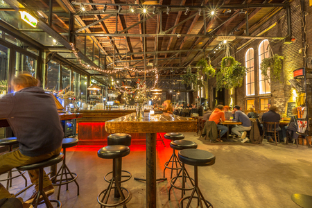 Interior of a cafe in the former Western Gas Factory or Westergasfabriek in Amsterdam. Nowadays a Public place for creative events like music and art.のeditorial素材