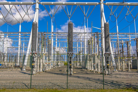 Modern high-voltage Power substation with switch on blue sky backgroundの写真素材