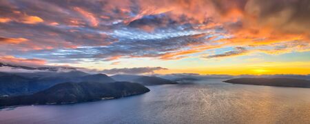 Aerial overview of Norwegian fjords at sunset in midfjord near Molde Norwayの写真素材