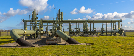 Old Natural gas field processing site in flat countrysideの写真素材