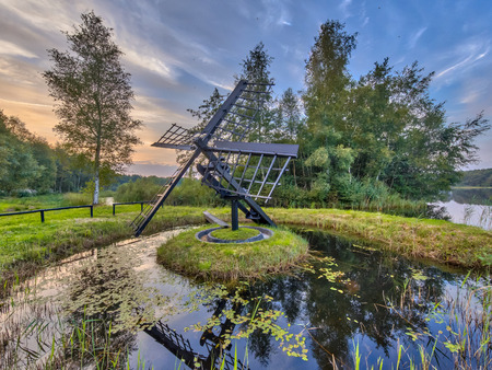 Primitive wooden Tjasker windmill in Friesland Netherlandsの写真素材