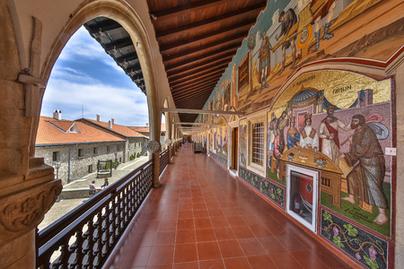 CYPRUS, PAPHOS- MAY 2 2016: Arcade of famous Kykkos monastery. With religious mosaics on the walls