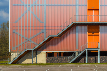 Modern building facade with Emergency exit escape ladder on the exterior