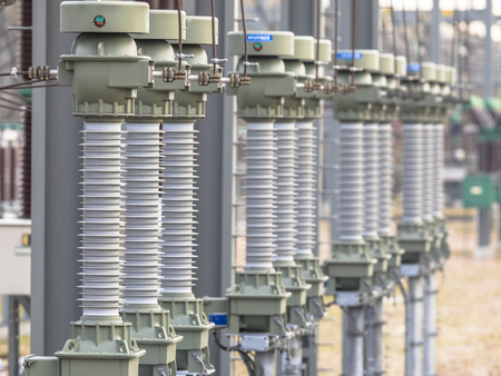 Close up of modern  isolators on High voltage electricity transformation substation