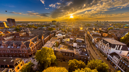 Aerial Skyline view of historic Groningen city centre under setting sun. The Netherlandsの写真素材