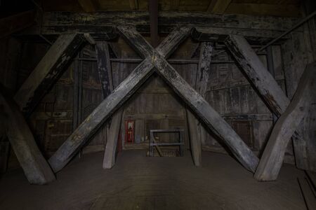 Historic architecture interior background of a church tower in Europe. Low key image at night in darkness. Groningen, Netherlands.の写真素材
