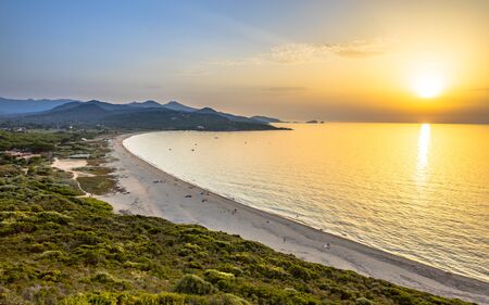 Golden sunset over Losari beach on East coast of Corsica near Ile Rousse, Franceの写真素材
