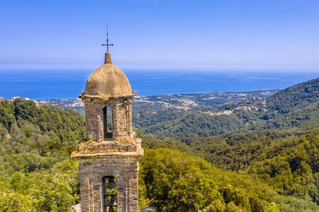 Church tower in the mountains of Corsica near San Giovanni di Moriani, France