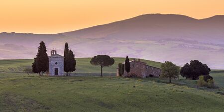 Chapel of Madonna in morning light in the hills of Tuscany, Italy, April.の写真素材