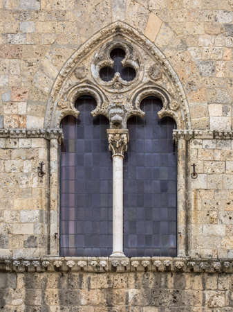 Gothic window in the Palazzo Pubblico of Siena, Tuscany, Italy, April.の写真素材