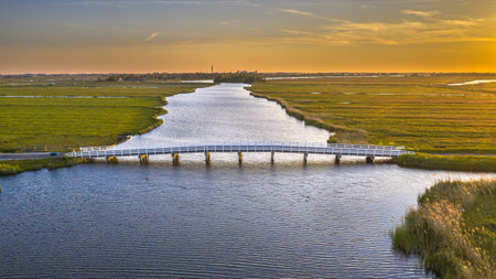 Long wooden bridge in agricultural landscape near Jisp, Noord Holland, The Netherlands.