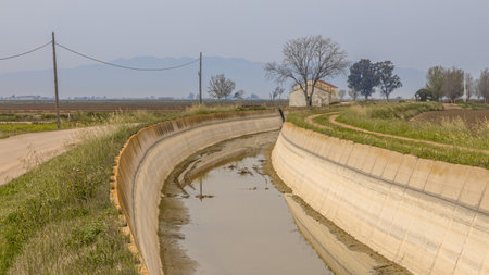 Dry irrigation channel in Ebro delta. Drought causig water shortage as a result of global warming. Spainの写真素材