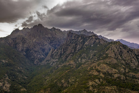 Stormy weather over dramatic rugged mountains of Corsica, Franceの写真素材