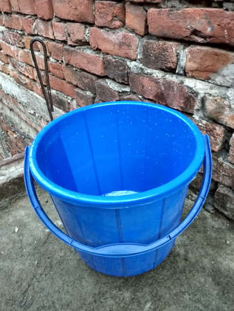 A blue bucket made with plasticの写真素材