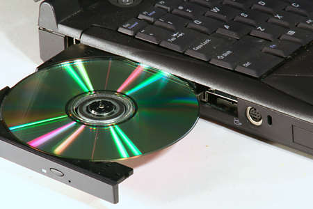 loading cd rom into laptopの写真素材