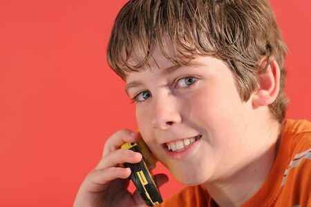 young boy on cell phoneの写真素材