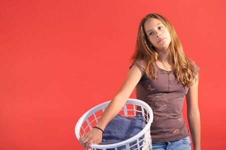 girl with laundry basket rightの写真素材