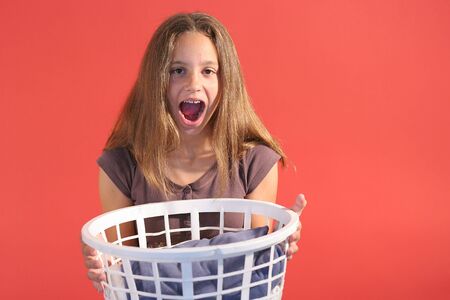 girl with laundry basket centerの写真素材