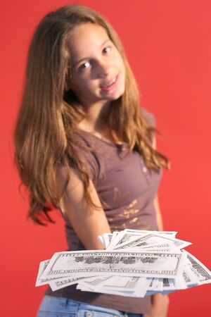 girl handing money 2の写真素材