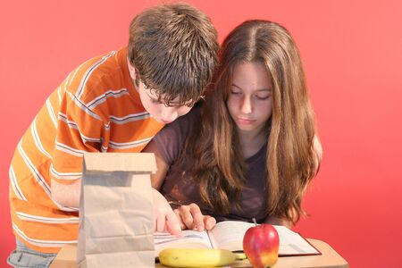 boy & girl doing homeworkの写真素材
