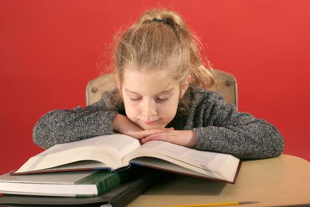 child studying head downの写真素材