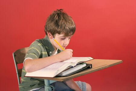 kid studying at deskの写真素材