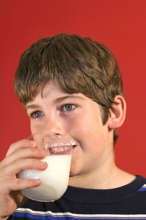 boy drinking milk verticalの写真素材