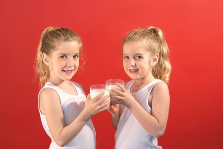 twins drinking milk smileの写真素材