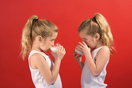twins drinking milkの写真素材