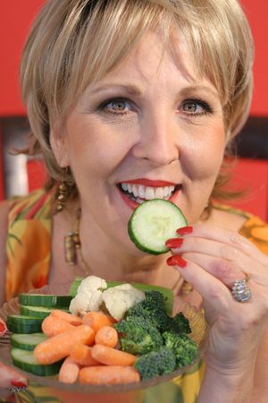 woman eating healthy food upclose verticalの写真素材