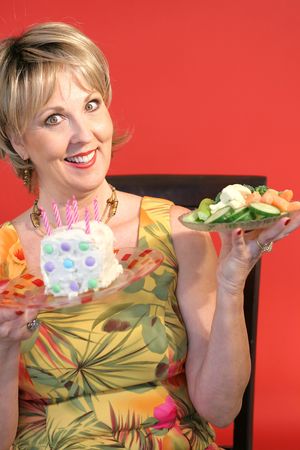 choices - healthy food or cake verticalの写真素材