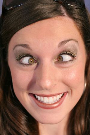cross eyed funny face womanの写真素材