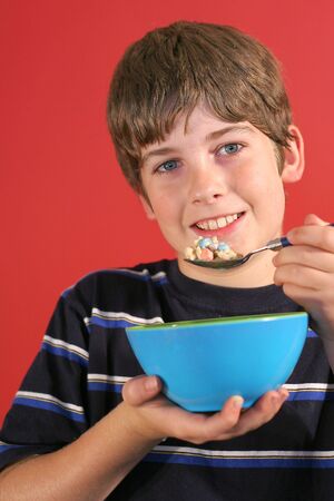 boy eating cereal verticalの写真素材