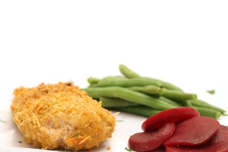 Oven fried chicken with green beans & beetsの写真素材