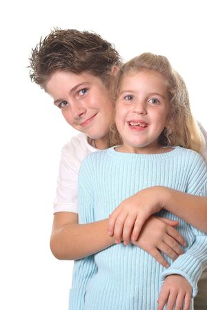 brother hugging sister verticalの写真素材
