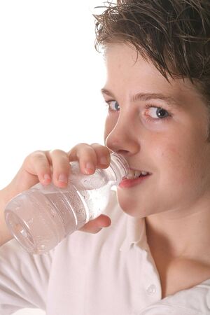 young boy drinking water vertical upcloseの写真素材