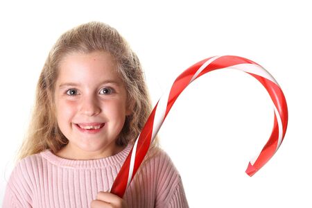 little girl with candy cane の写真素材