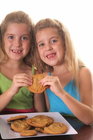 children sharing a cookieの写真素材