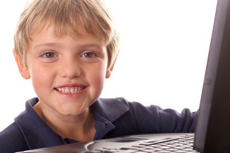 happy little boy with laptop computerの写真素材