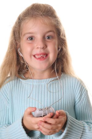little girl listening to musicの写真素材