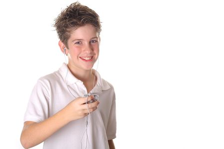young boy listening to musicの写真素材