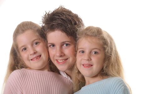 Three siblings on white の写真素材