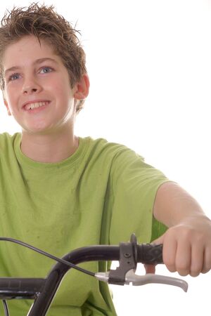 young boy riding bicycle verticalの写真素材