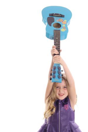 rockstar child smashing her guitar straightの写真素材
